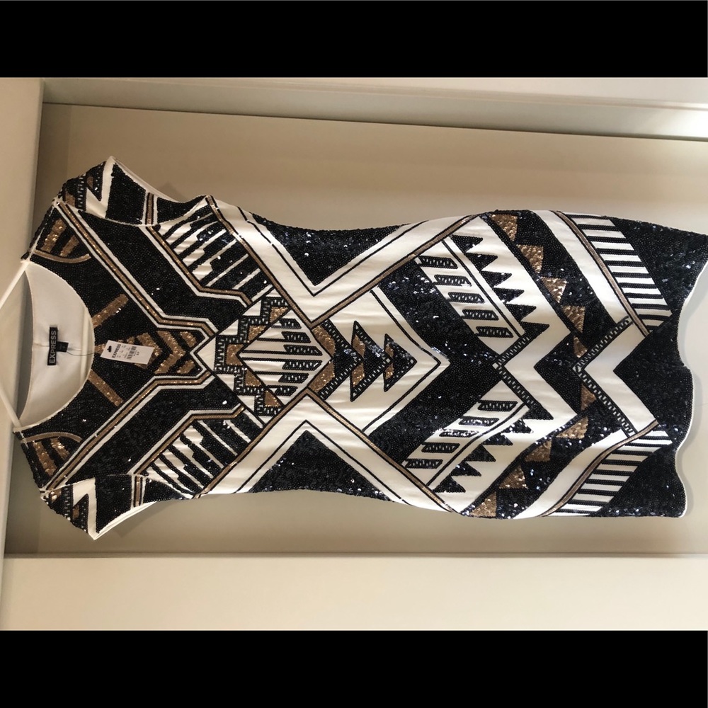 Sequin bodycon dress with cap sleeves.